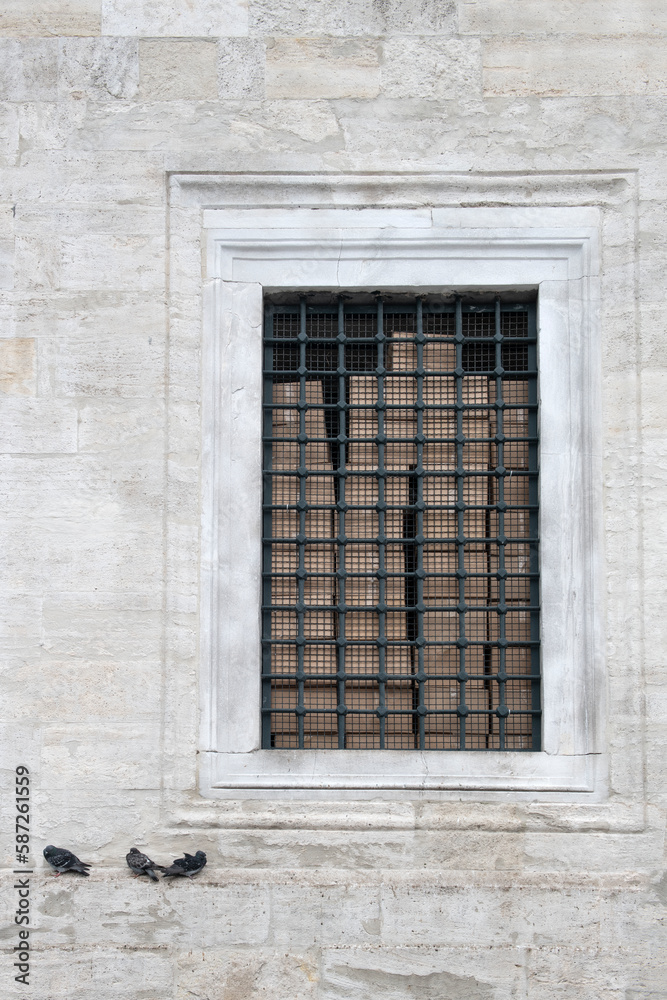 Eminonu Yeni Mosque window and pigeons resting on its edge. Mosque wall. Mosque wall made of cut stone.
Eminonu New Mosque, Istanbul. Eminonu Yeni Mosque window and pigeons resting on its edge. Mosque wall. Mosque wall made of cut stone.
Eminonu New Mosque, Istanbul.