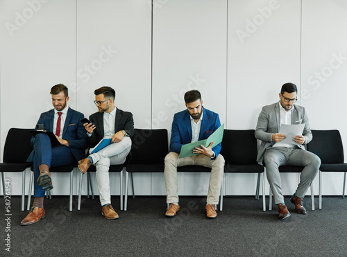 man business chair sitting waiting businessman candidate recruitment office businessperson job young interview line employee career row hall colleague