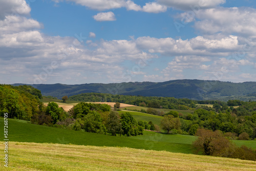 beautiful landscape in summer with fields and meadows in Odenwald region in Germany © electricmango