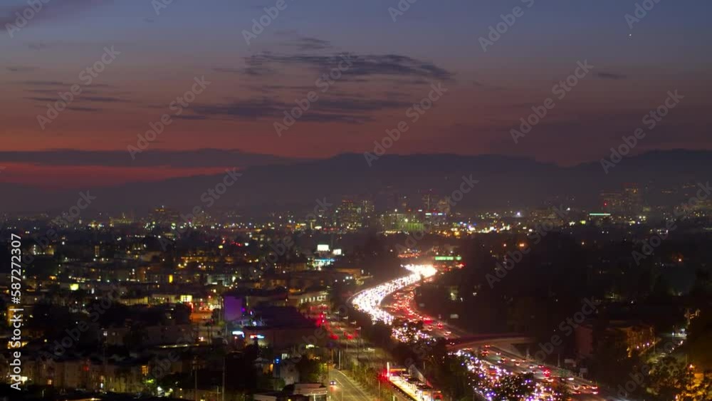 Aerial Panning Shot Of Cars Moving On Roads Amidst Illuminated Houses In City At Night - Culver City, California Aerial Panning Shot Of Cars Moving On Roads Amidst Illuminated Houses In City At Night - Culver City, California