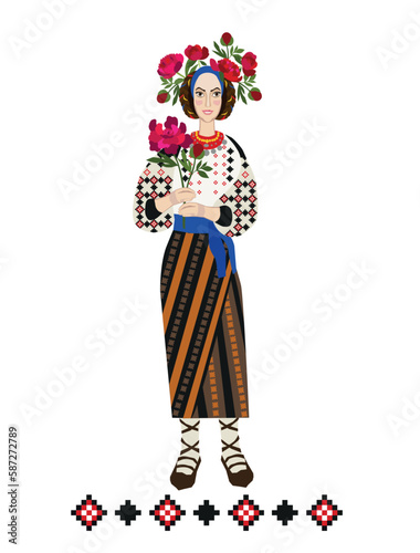 Girl in traditional Romanian clothes with a bouquet of peonies, the symbol of Romania. Folk costume.