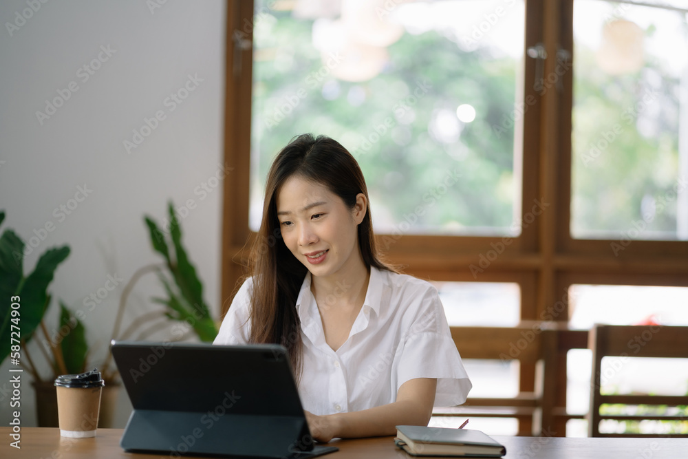 women hand working with tablet and laptop computer at home office. women hand working with tablet and laptop computer at home office.