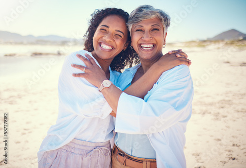 Portrait, family and mother with adult daughter hug, happy and bond at beach together, smile and relax. Love, parent and girl embrace, travel and excited for ocean trip, holiday and freedom in Miami