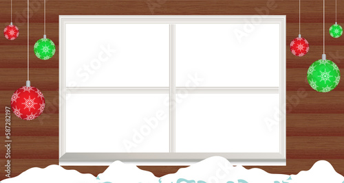 Snow and hanging bauble decoration over window frame against wooden background