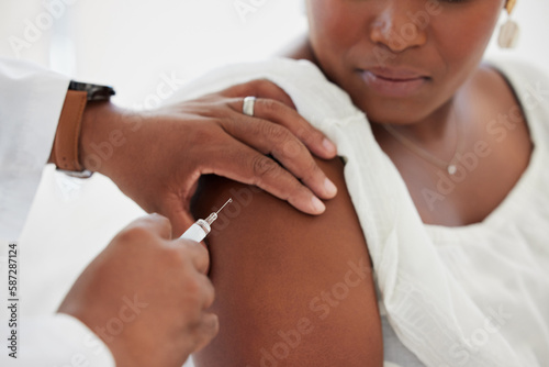 Hand, covid vaccine and a woman with her doctor in the hospital for an injection of medicine or antibiotics. Healthcare, medical and a consulting with a male medicine professional holding a syringe