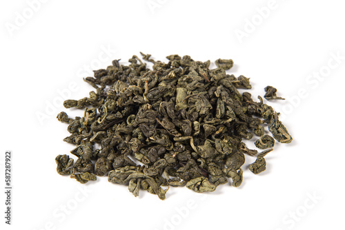 dry green tea leaves isolated on white background