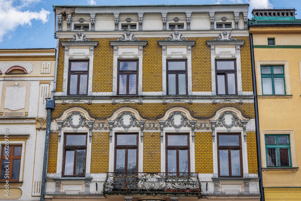 Facade of yellow house on Old Town Market Square in historic part of Cieszyn, Poland