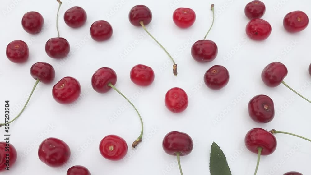 cherries lie on a white background, departure of the camera cherries lie on a white background, departure of the camera