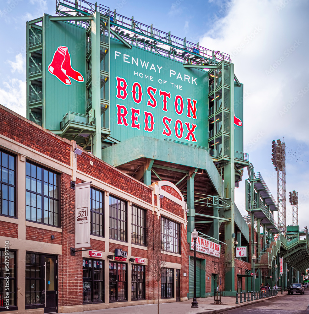 View of the historic architecture of the Fenway Park Stadium in Boston,  Massachusetts, USA showcasing its signs and statues of famous baseball  players. Stock Photo