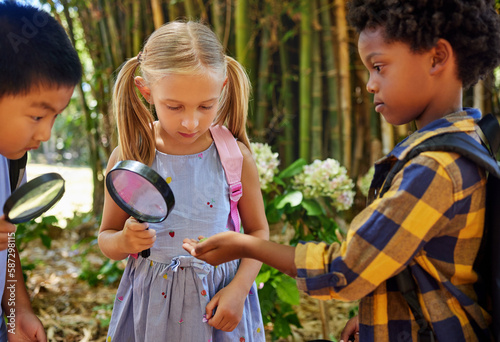 Fotografie Friends, nature or children at summer camp, magnifying glass or growth outdoor, speaking or ideas