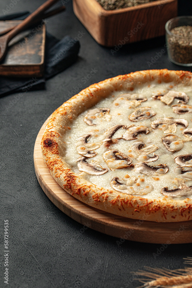 Freshly baked gourmet pizza with mushrooms and cheese Freshly baked gourmet pizza with mushrooms and cheese