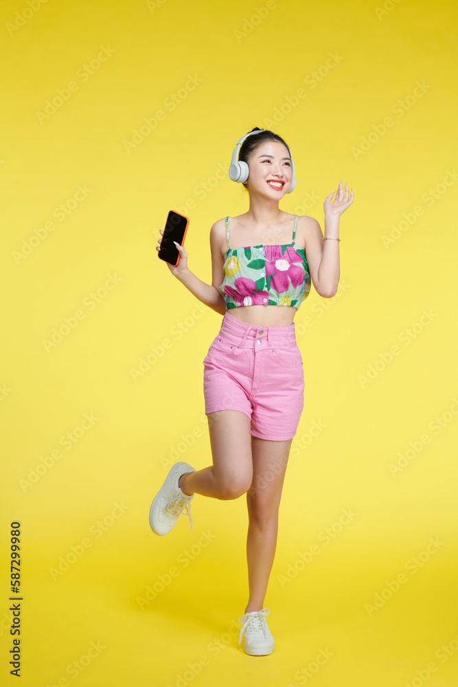 Girl enjoying wireless earphones and dancing Girl enjoying wireless earphones and dancing