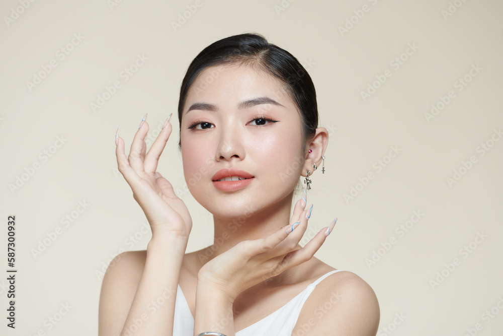 Smiling asian woman touching healthy skin portrait Smiling asian woman touching healthy skin portrait