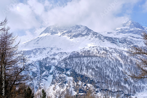 Canton Graubunden  Switzerland   Landscape in Alp Grum train station  Bernina express  during winter season