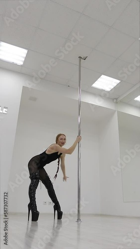 Fit woman dancing erotic dance in studio