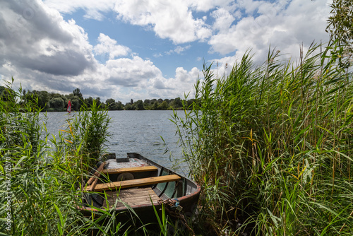 Fototapeta Naklejka Na Ścianę i Meble -  Boat on a lake with blue sky in summer