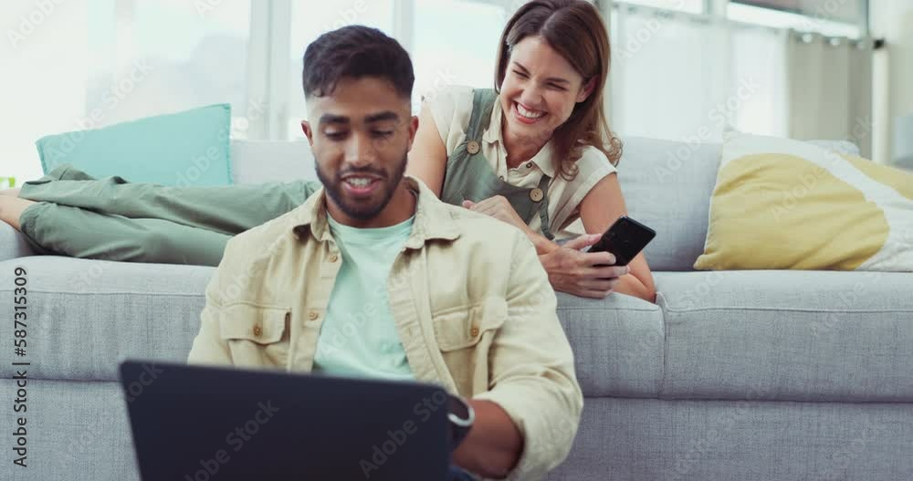 Phone, laptop and couple relax in a living room while online for property, home loan or mortgage discussion. Internet, search and man with woman browsing real estate, rental or apartment listing Phone, laptop and couple relax in a living room while online for property, home loan or mortgage discussion. Internet, search and man with woman browsing real estate, rental or apartment listing