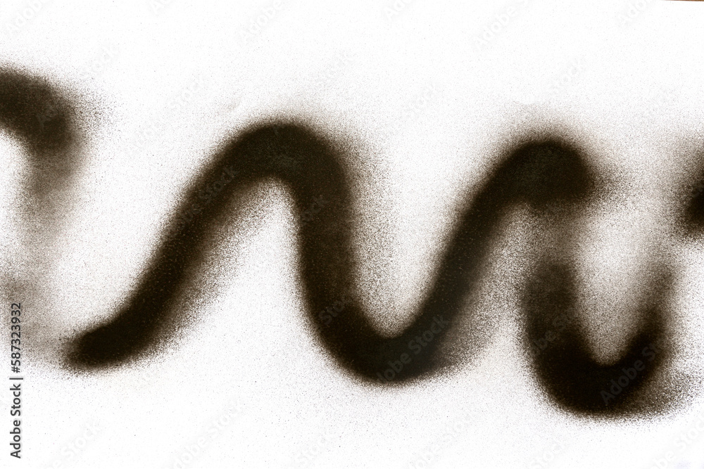 wavy line of black spray paint on white paper background wavy line of black spray paint on white paper background