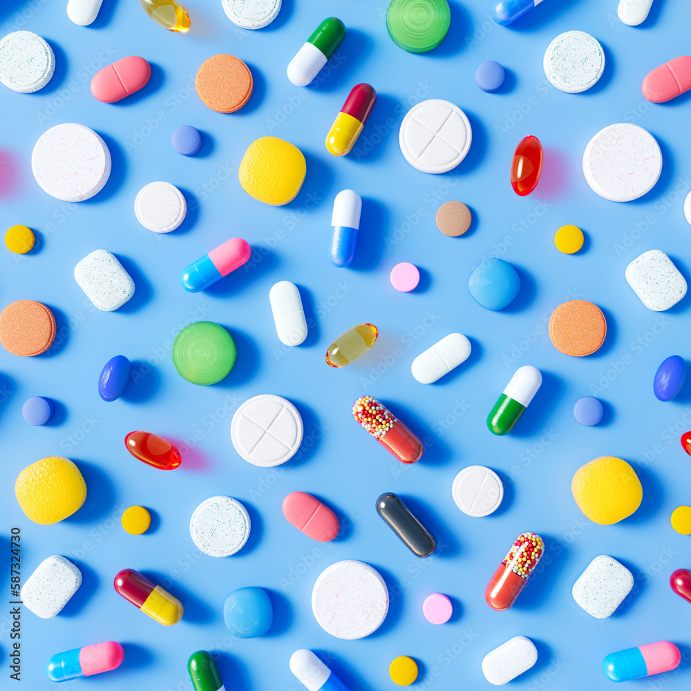 Multi-Colored Pills and Tablets Scattered on Light Blue Background