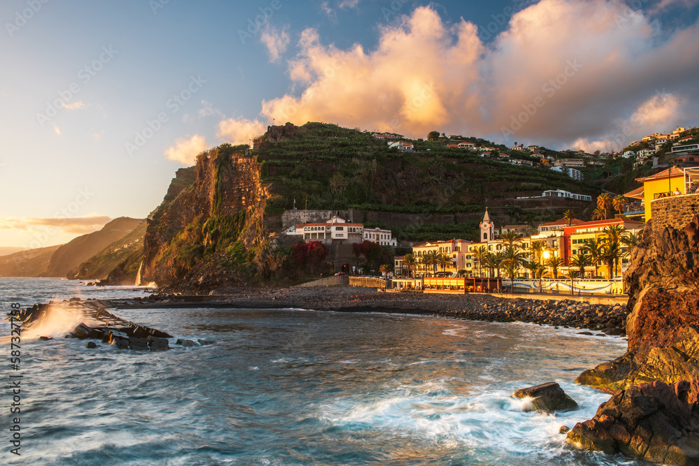 Sunset at Ponta do Sol, town at atlantic ocean with beach and cliffs in Madeira, Portugal