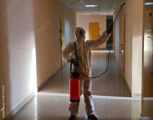 Canvas-taulu Disinfection in protective suit and respirator treating surfaces with antiseptic