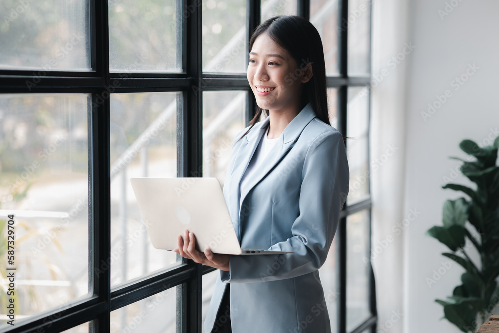 A businesswoman is checking company financial documents and using a tablet to talk to the chief financial officer through a messaging program. Concept of company financial management.