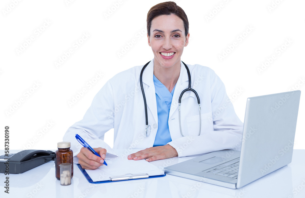 Portrait of smiling female doctor writing on pad
