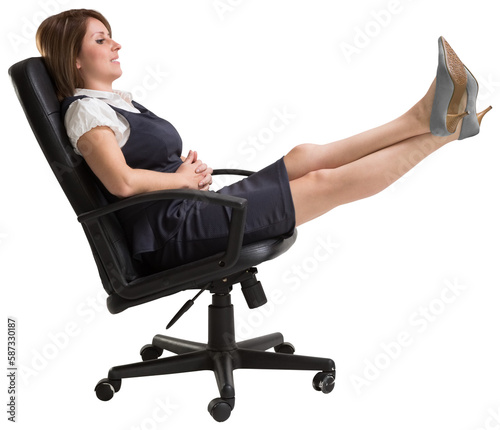 Side view of businesswoman relaxing on swivel chair