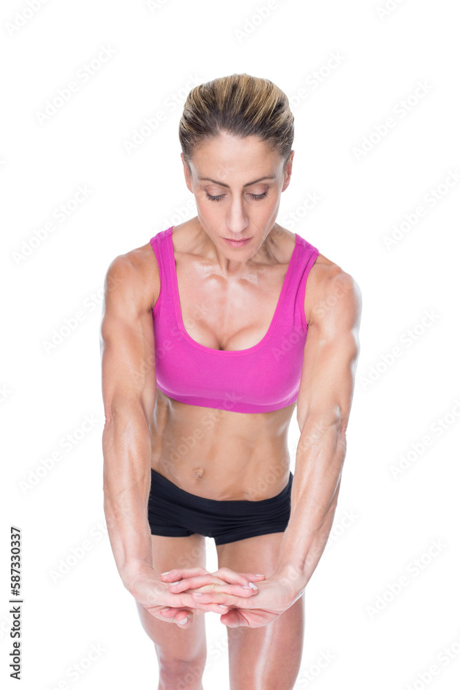 Female bodybuilder flexing with hands together Female bodybuilder flexing with hands together