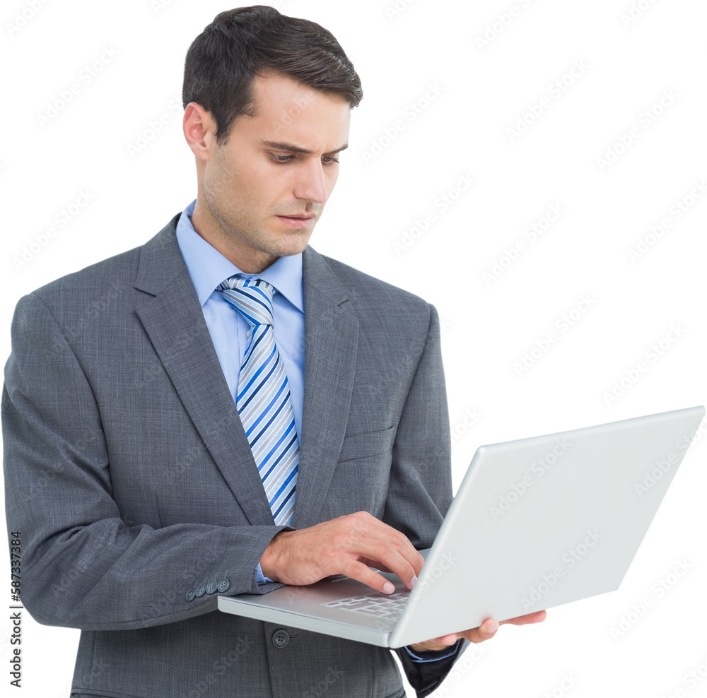 Businessman using laptop with colleagues behind Businessman using laptop with colleagues behind