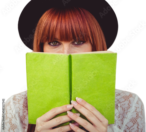 Hipster woman behind a book