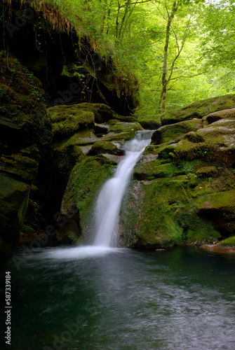 Waterfall at the source of the La Bidouze river in the French Basque Pyrenees.France