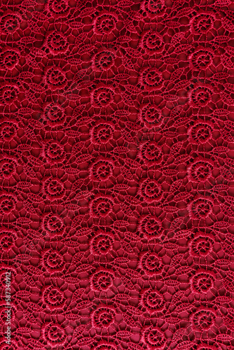 chic burgundy background of vintage lace. vertical view. background for design, decor.