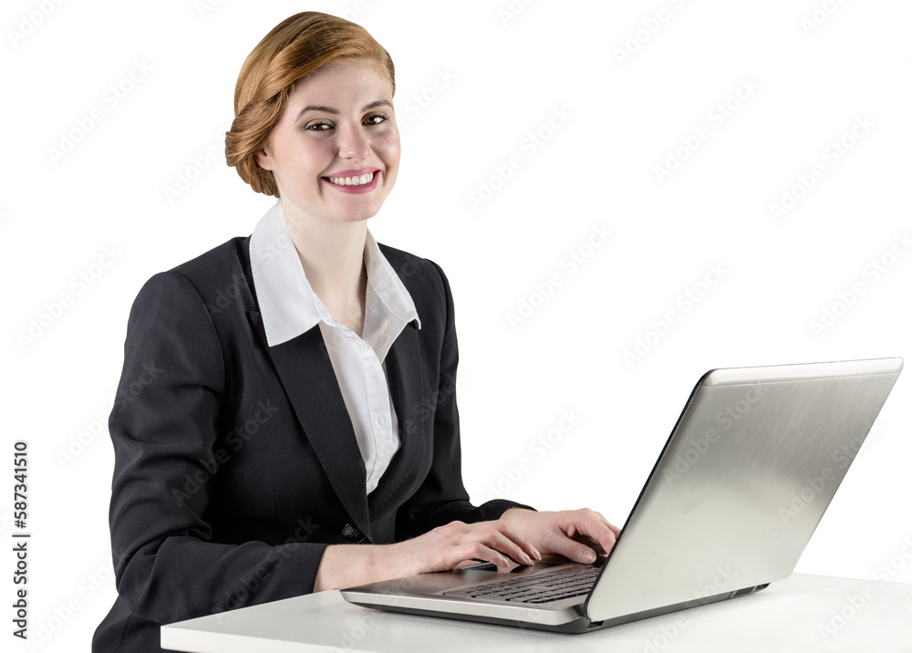 Redhead businesswoman using her laptop Redhead businesswoman using her laptop
