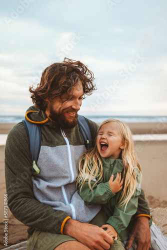 Family father with child outdoor dad with daughter happy laughing face vacations lifestyle together candid emotions