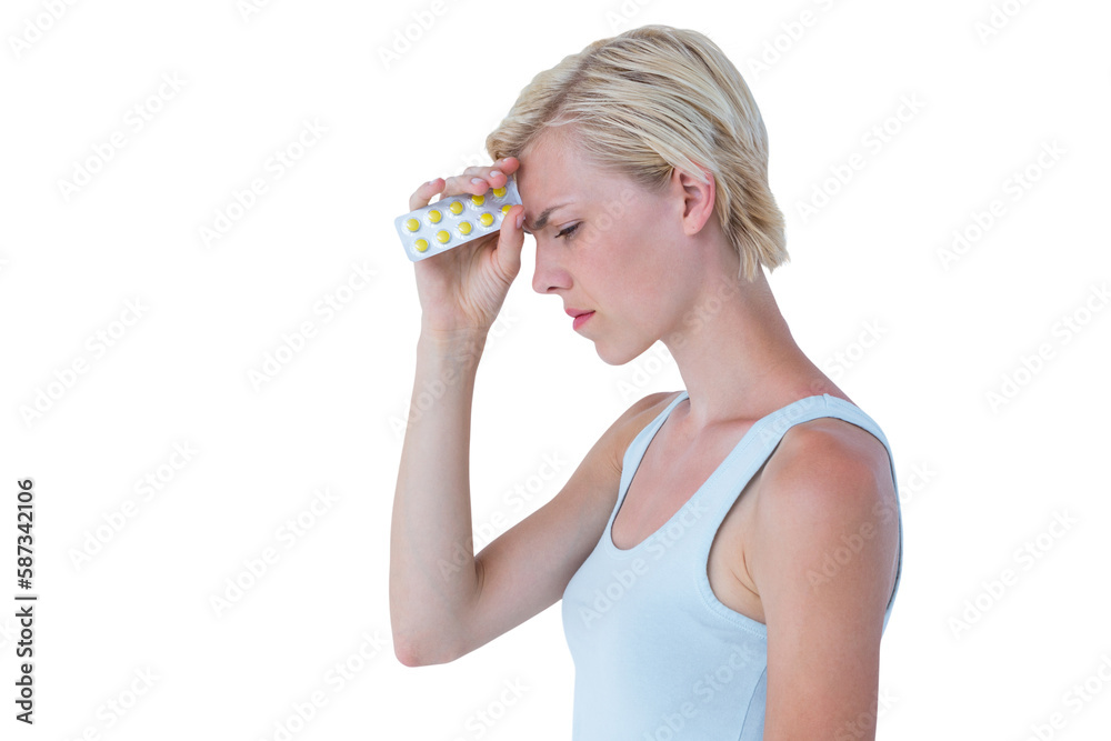 Attractive woman having headache and holding pack of pills Attractive woman having headache and holding pack of pills