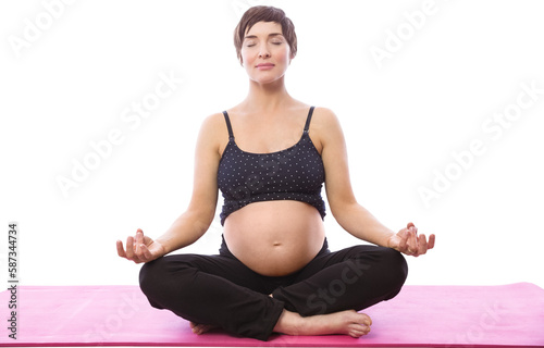 Pregnent woman sitting on mat in lotus pose over white background