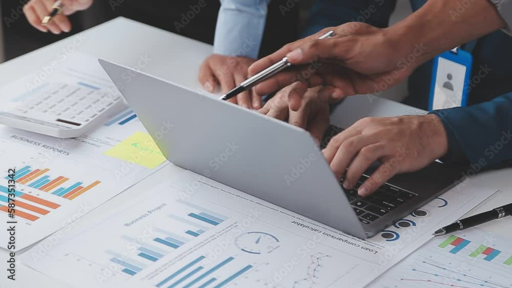 Financial analysts analyze business financial reports on a digital tablet planning investment project during a discussion at a meeting of corporate showing the results of their successful teamwork.