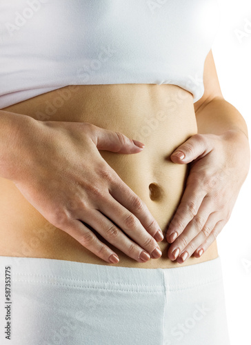 Slim woman touching her belly