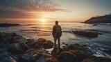 A traveler standing on a rocky shoreline, watching the sun set over a tranquil, glassy sea Generative AI
