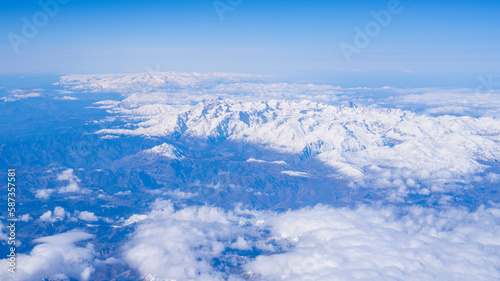Fototapeta Naklejka Na Ścianę i Meble -  Sky, clouds, snowy mountains, sunny and beautiful sky view.