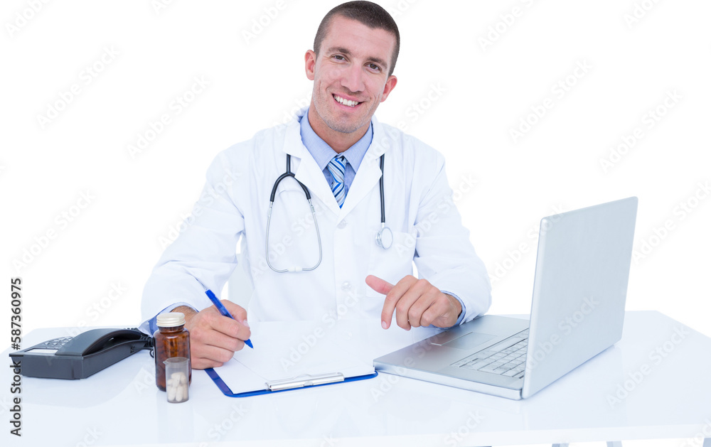Portrait of smiling male doctor writing while sitting by desk Portrait of smiling male doctor writing while sitting by desk