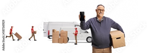 Workers loading boxes in a van and mature male customer holding a box and showing a smartphone photo