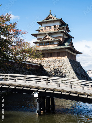 Wooden bridge across the moat leading to historic Takashima castle in Suwa - Nagano prefecture, Japan