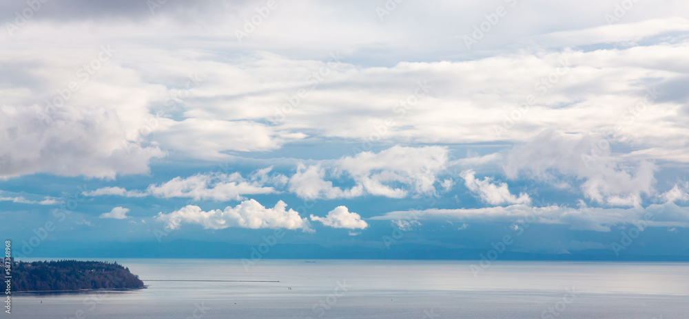 Fototapeta premium Colorful Cloudy Sky on the West Coast of Pacific Ocean. Cloudscape Nature Background. Vancouver, British Columbia, Canada.