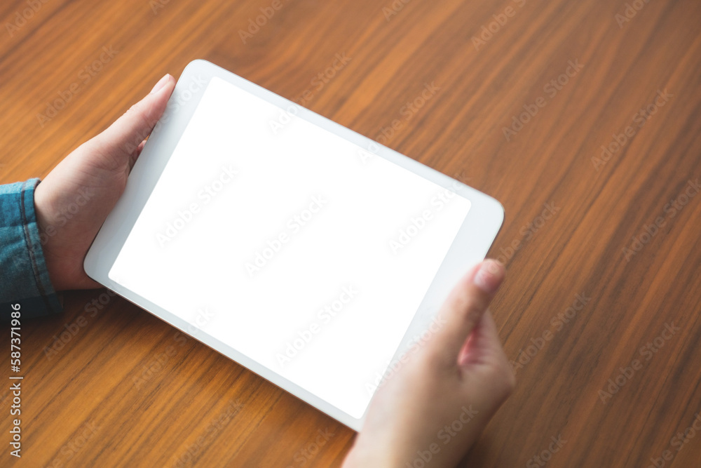 Cropped image of person holding digital tablet Cropped image of person holding digital tablet