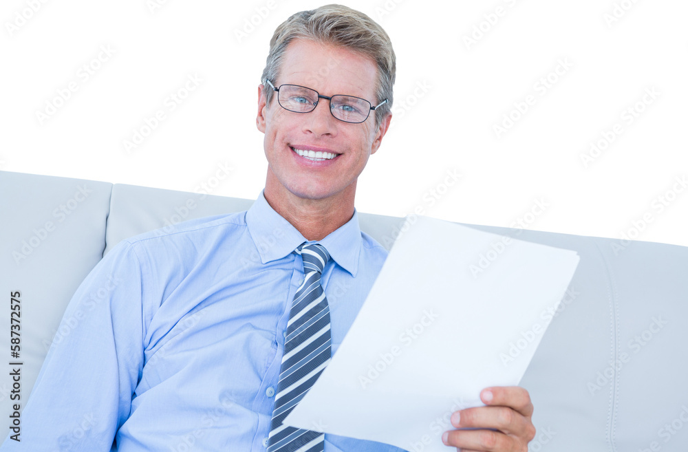 Businessman reading document at his desk Businessman reading document at his desk