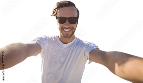 Smiling man taking a seflie photo