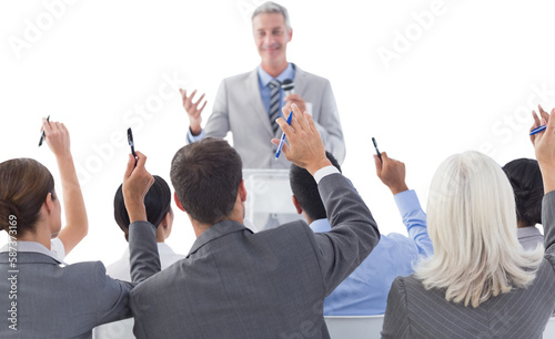 Business people raising their arms during meeting 