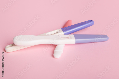 Rapid diagnosis of pregnancy at home. Pregnancy test kits with two bars on isolated pink pastel background. Copy ad space. Women s health  gynecology and medicine concept. Planning maternity concept